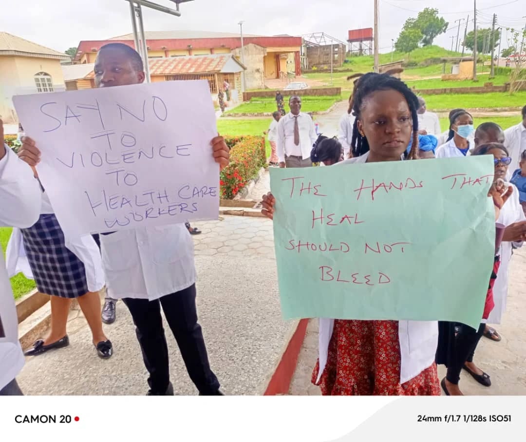 Protesters carrying placards with inscriptions against violence