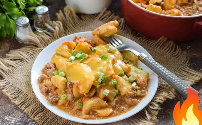 Фото Картофельные ньокки в мясном соусе, запечённые с сыром чеддер