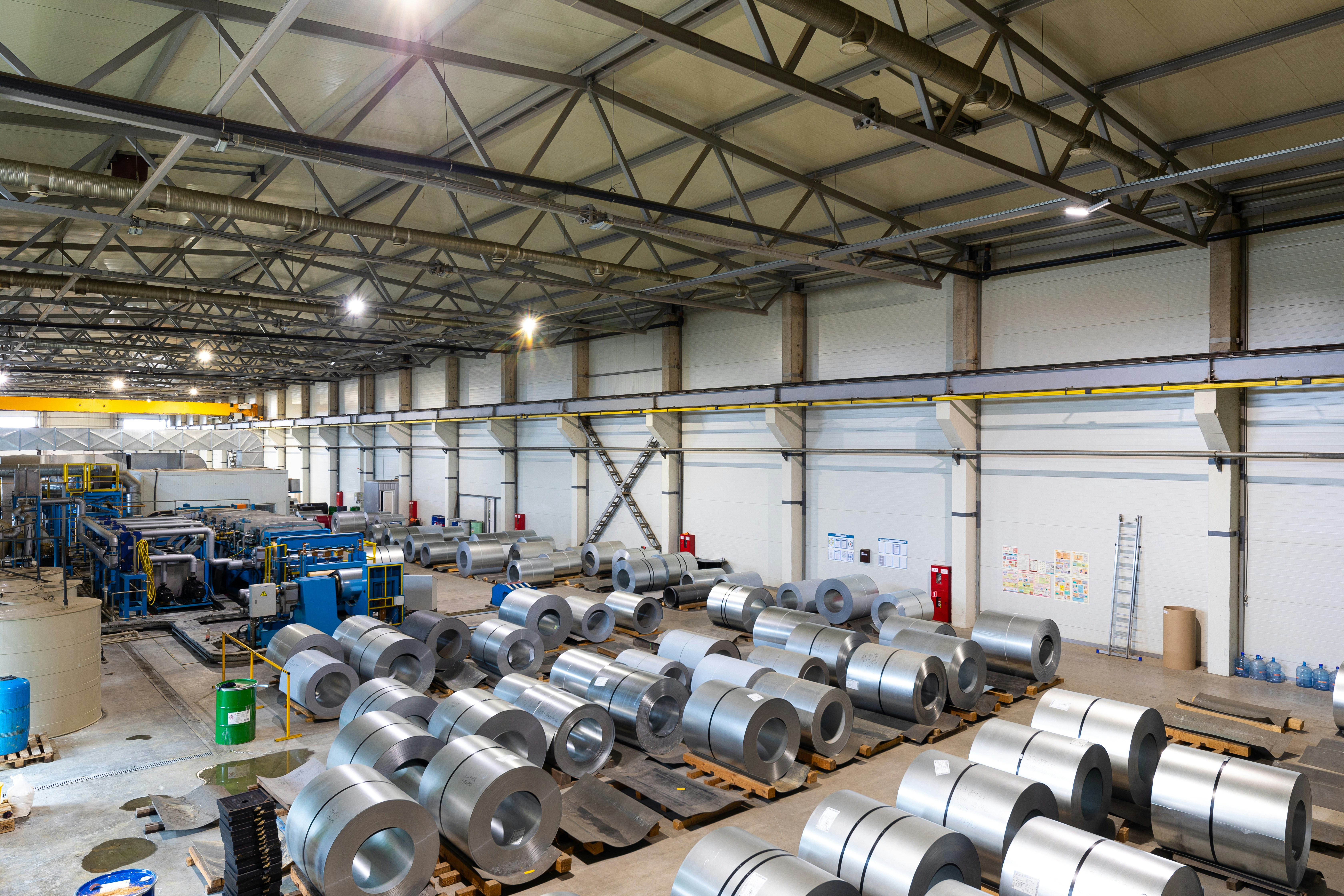 Aluminium coils stored in an industrial warehouse for metal repo financing and inventory-backed lending