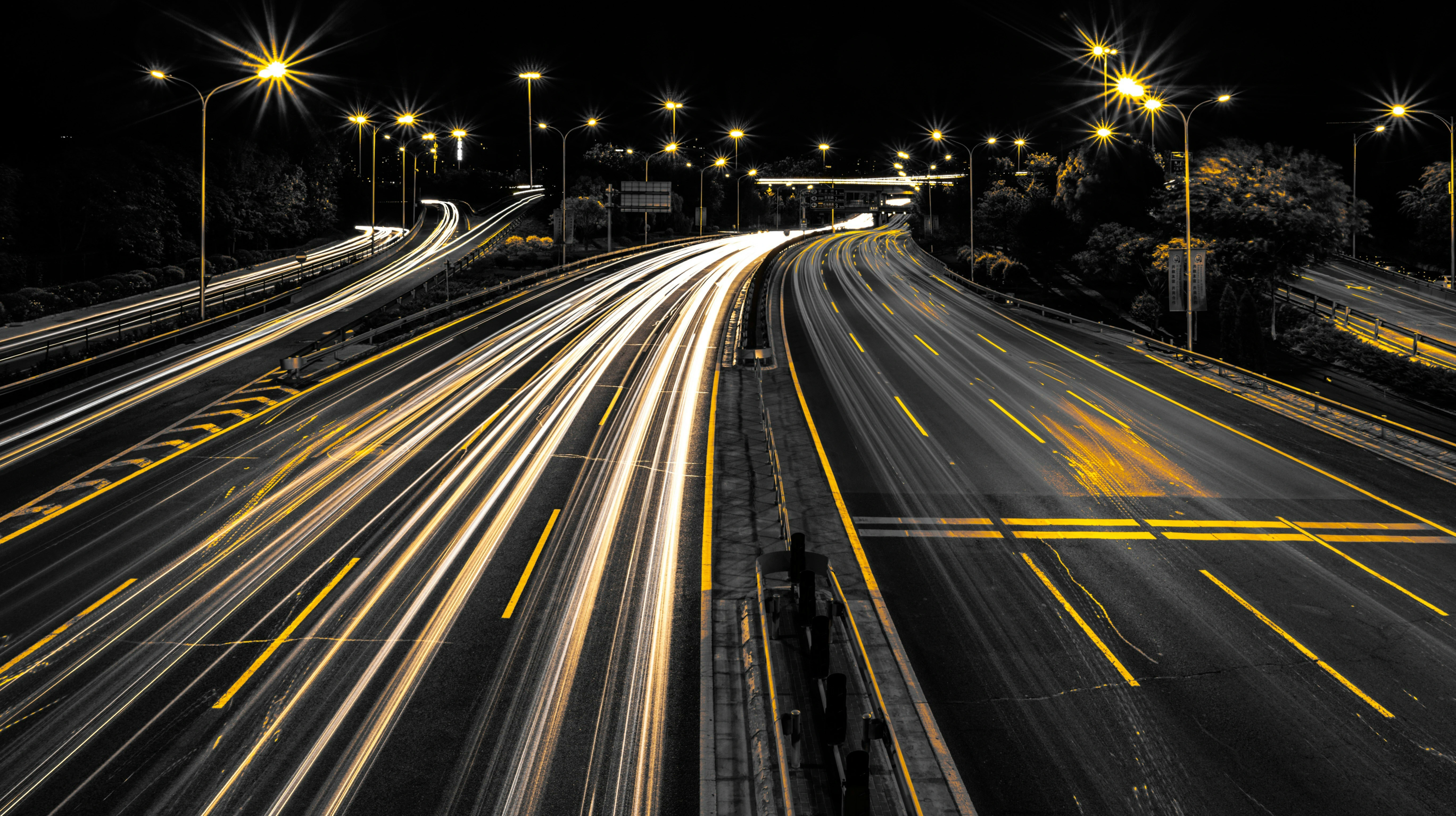 Long exposure light trails on a highway at night - the hidden movement of value in the digital economy