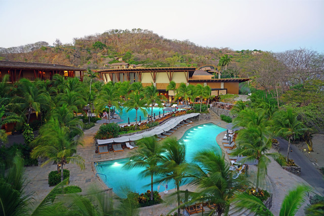 Aerial view of luxury homes and lush coastline on Papagayo Peninsula, Costa Rica, prime real estate for international buyers seeking exclusive oceanfront properties in 2025