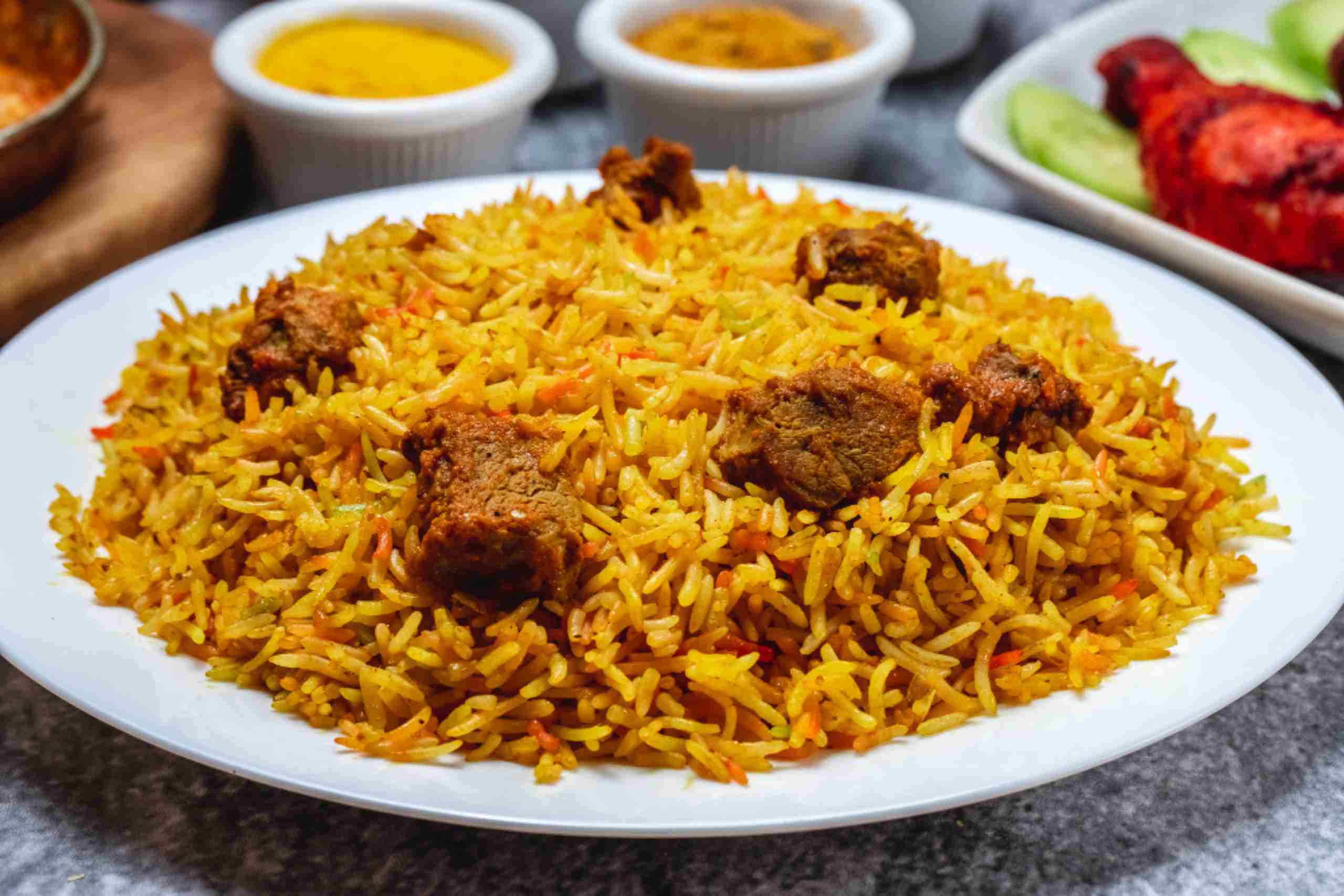 An image showing a serving of Pilau with stewed meat.