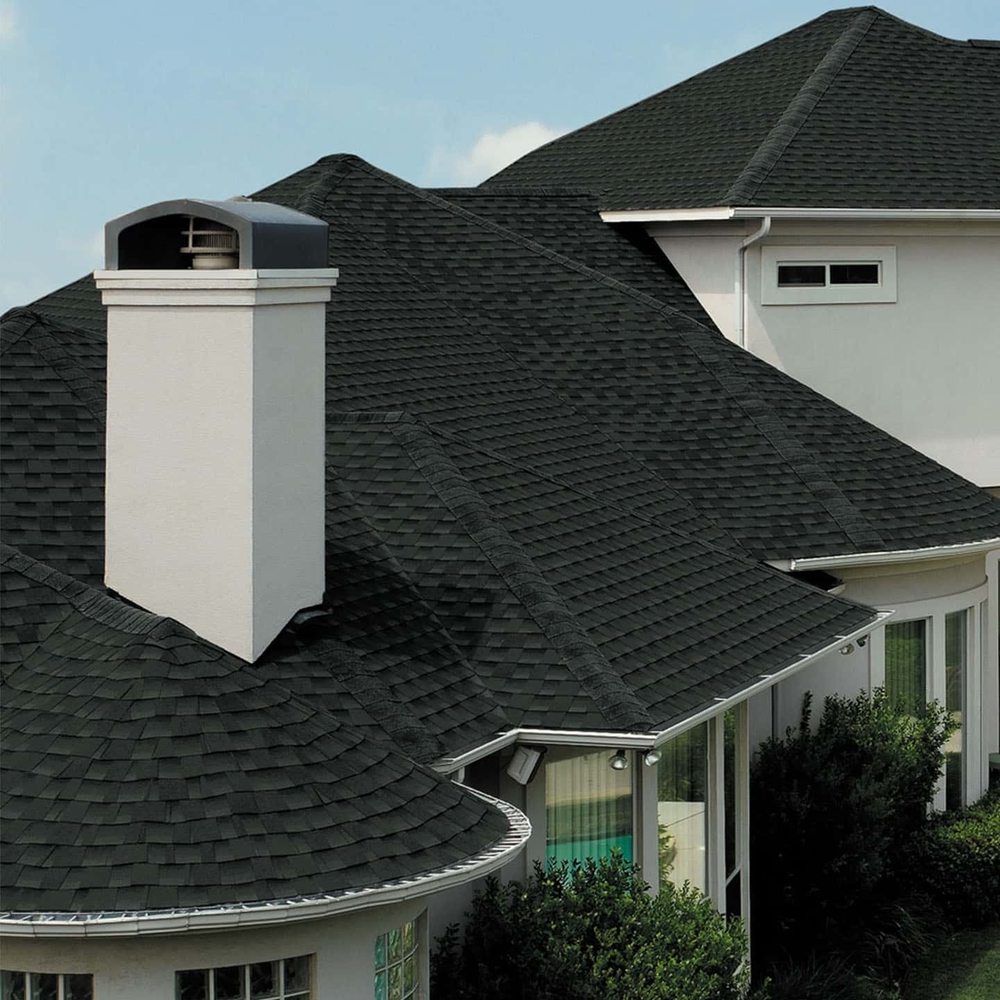 Professional roofing crew working on a residential home in Central New Jersey