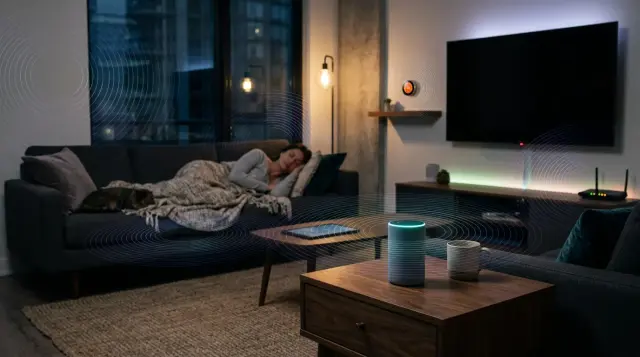 Sleeping person surrounded by glowing smart home devices emitting faint radio waves at night