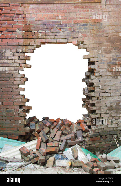 old brick wall with large hole smashed through BEJFDH