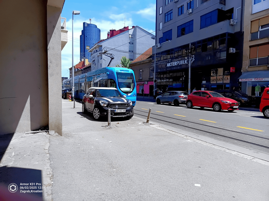 A blue tram on the streets of Zagreb.