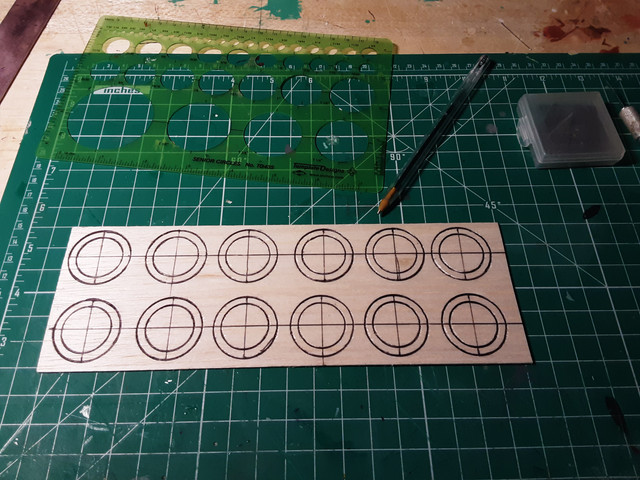 Cutting out the wheels. 3 pieces per wheel.