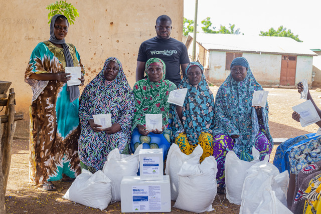 Community members with grain bags