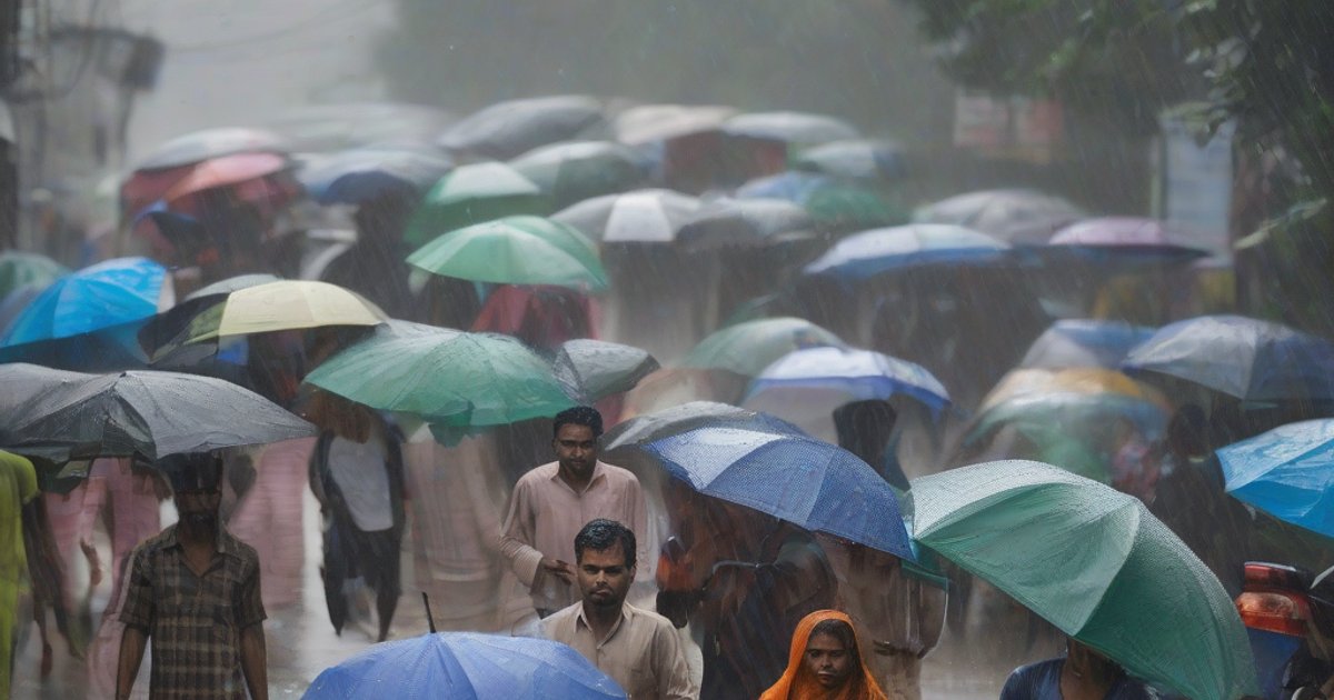 Dark clouds and heavy rain over Bangladesh countryside with strong winds affecting rural landscapes