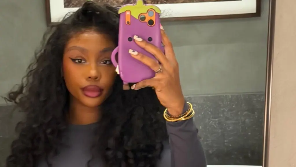 SZA Stuns in Daring Low-Neck Halter Dress