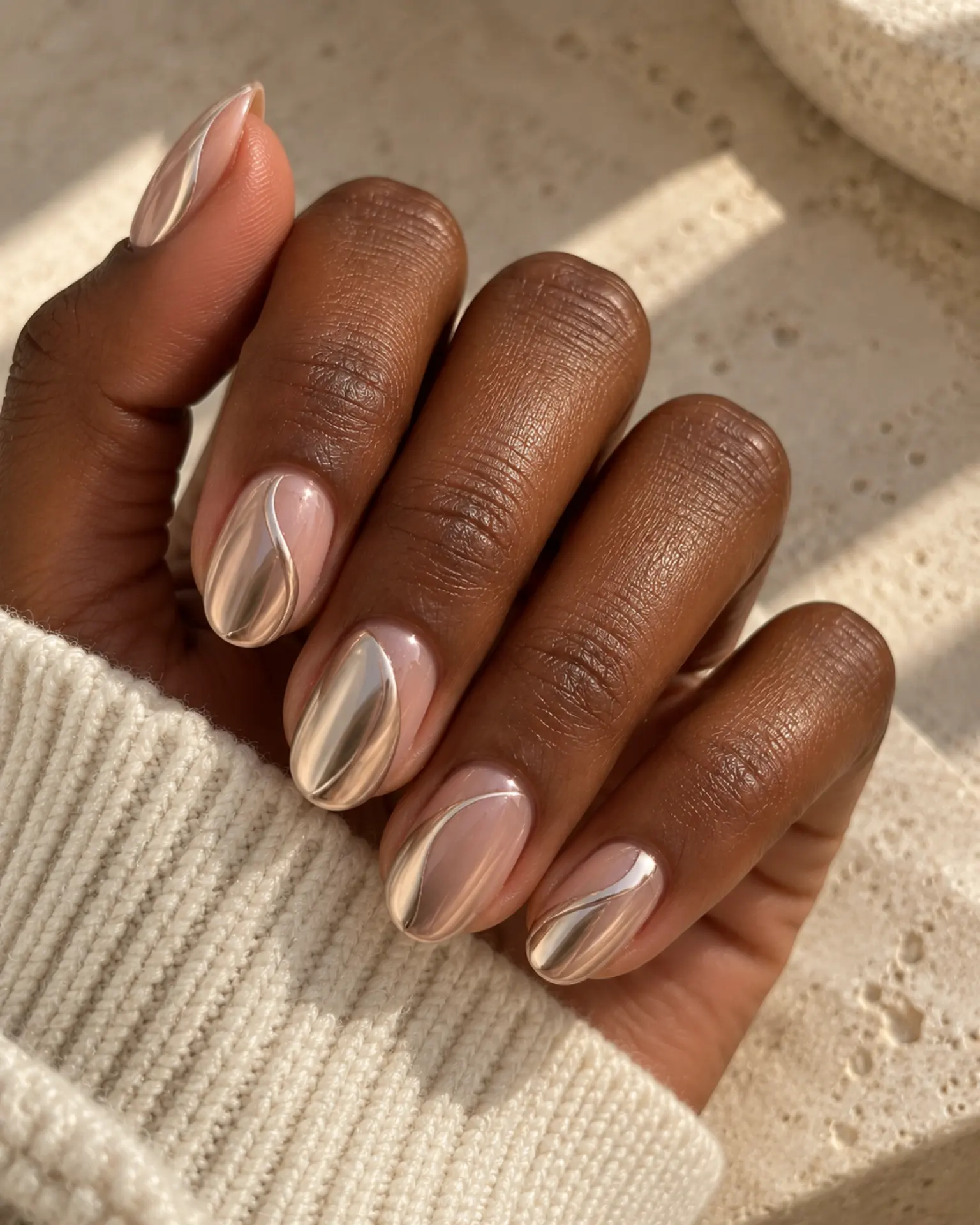 Chrome Negative-Space Curve manicure inspiration for chrome nail ideas