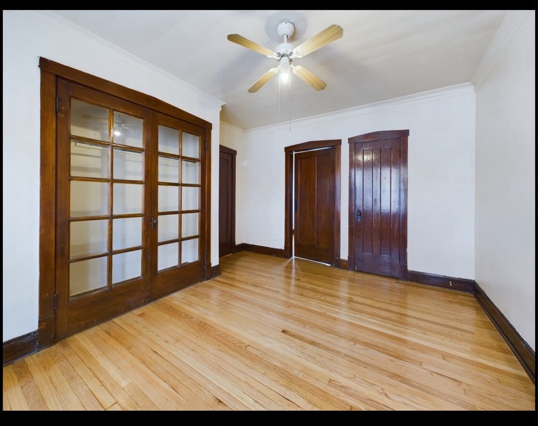 Restored apartment living room with French doors