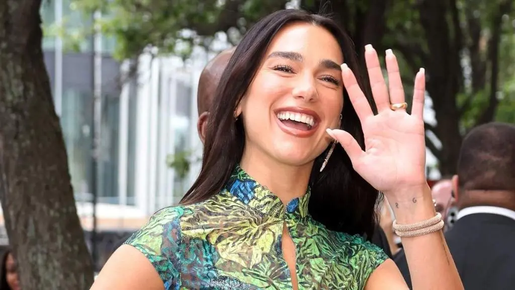 Dua Lipa Stuns in Bold Micro Minidress and Sheer Skirt at Paris Show