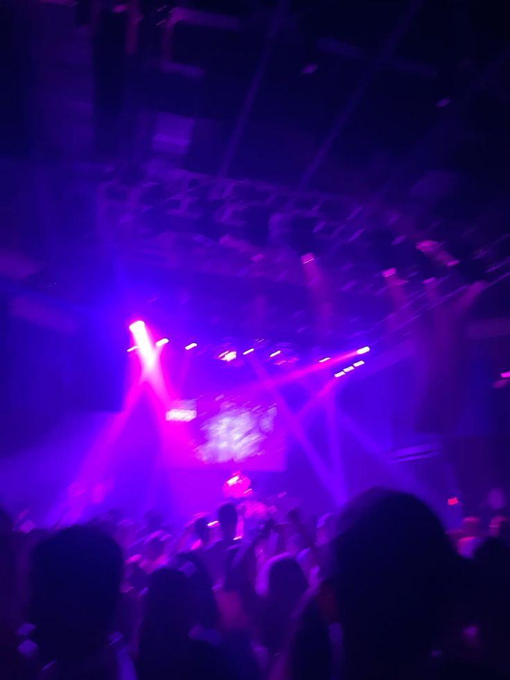 A blurry photo, predominantly purple, from a club.