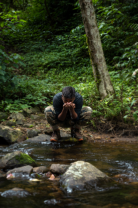 Person by the stream