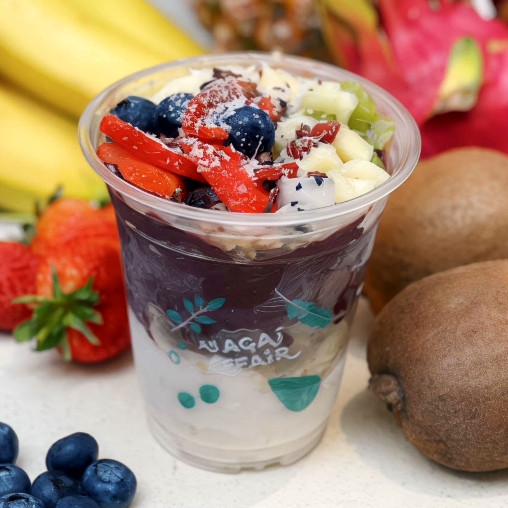 Acai bowl topped with fresh fruit and granola