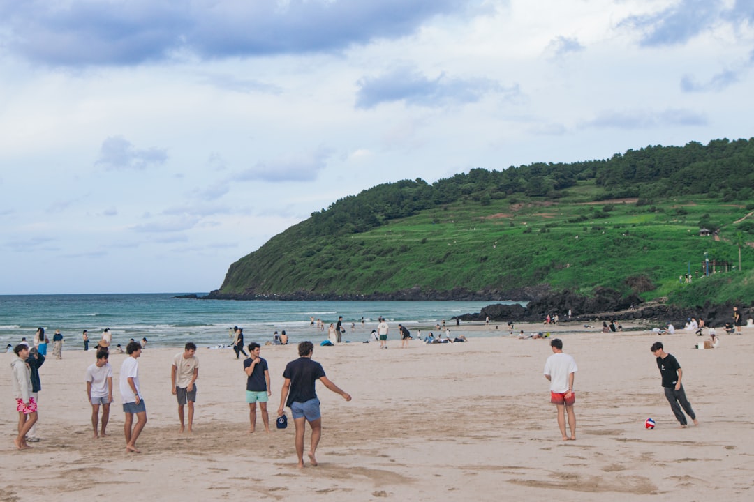 Hamdeok Beach turquoise water and white sand on Jeju Island northeast coast