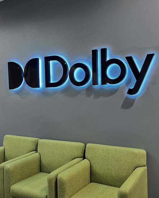 Modern lobby sign with brushed metal letters in corporate reception