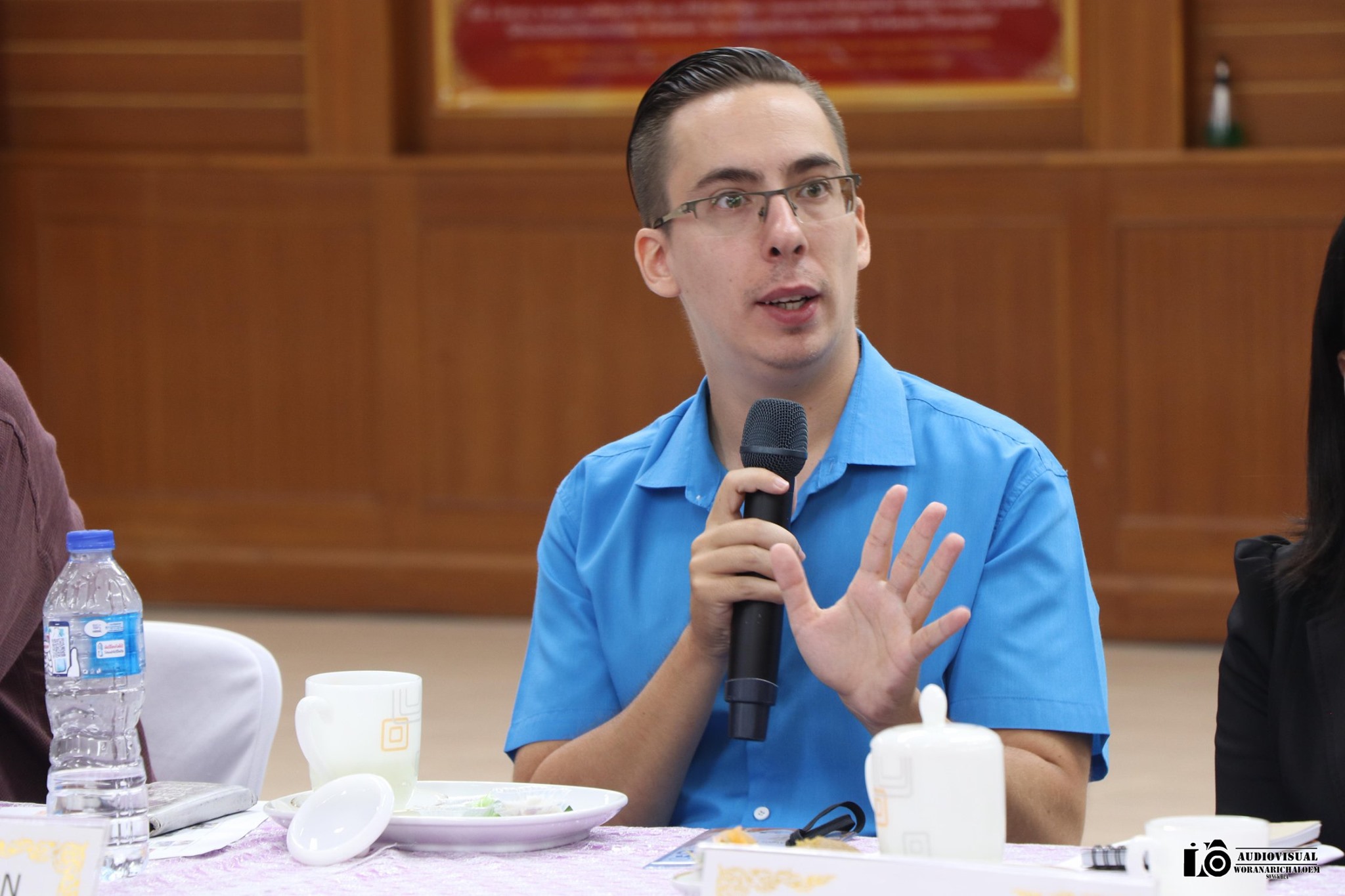 Teacher Alexis speaking at an event