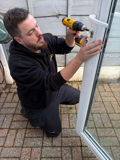 Locksmith drilling a lock