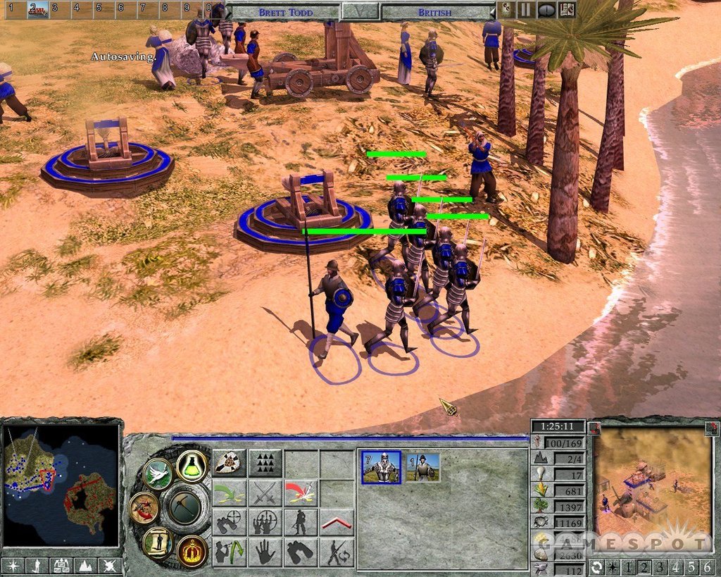 Empire Earth II infantry and artillery grouped along a sandy shoreline.