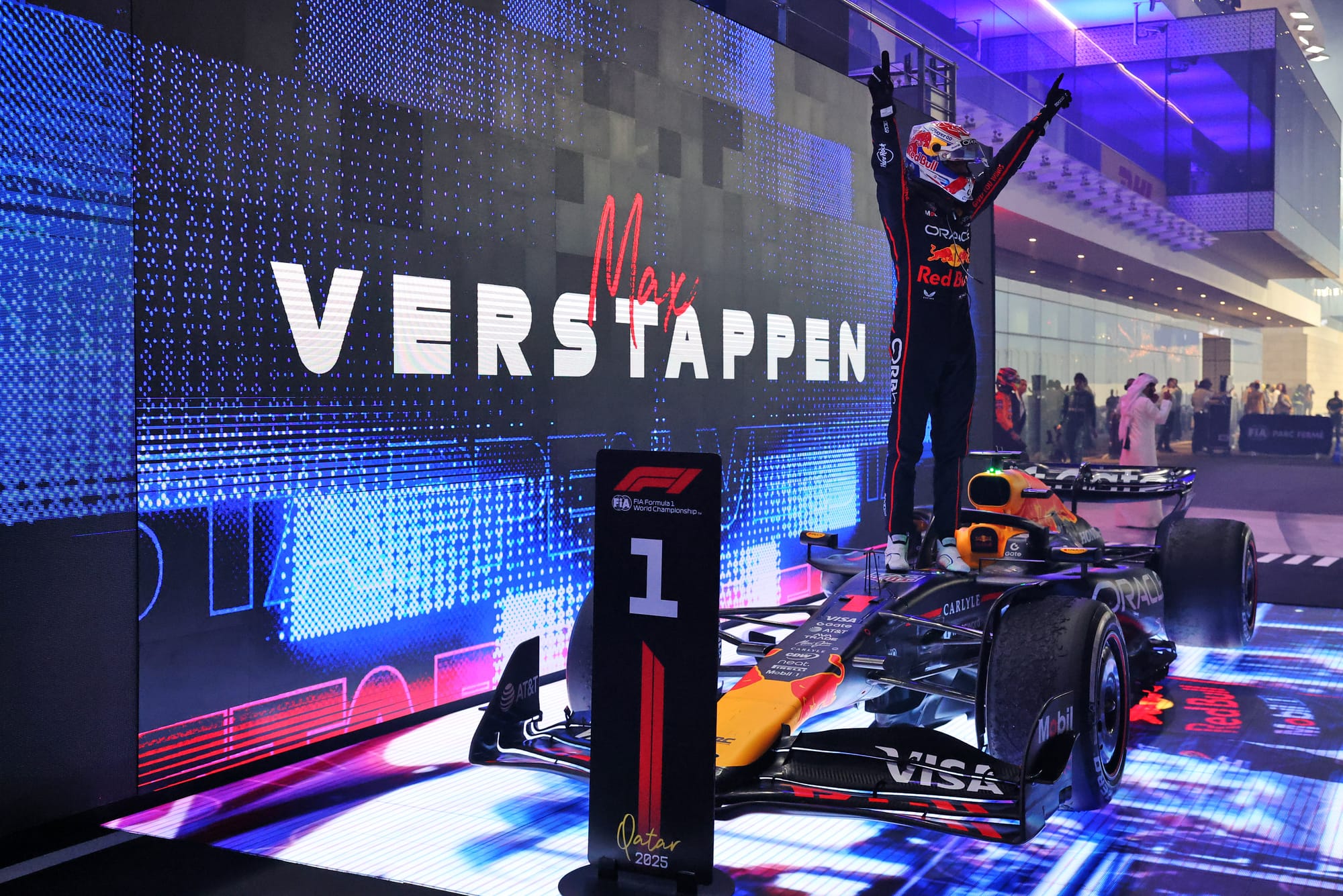 Formula 1 racing car speeding on track under night floodlights