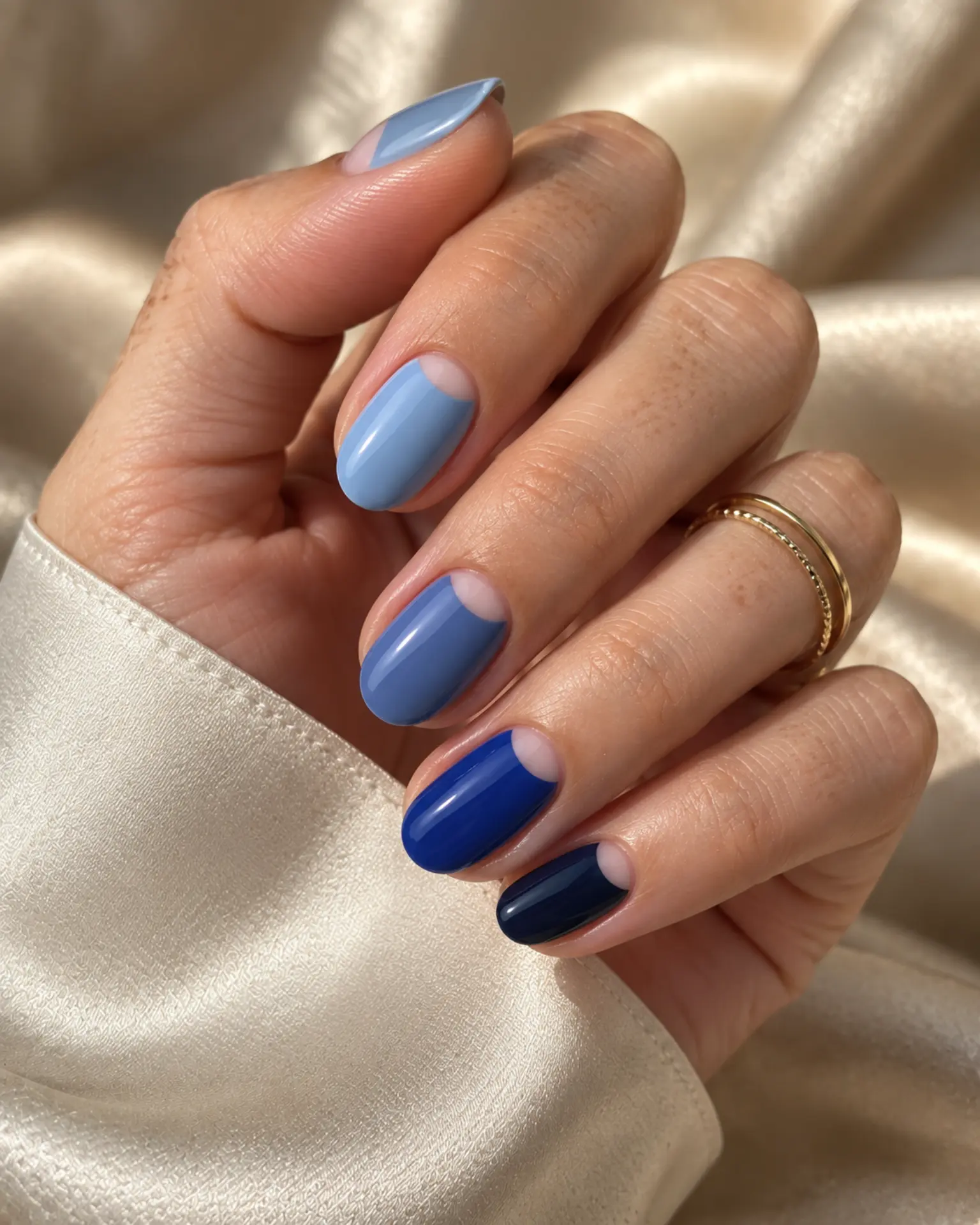 Blue Half-Moon Detail manicure inspiration for blue nail ideas