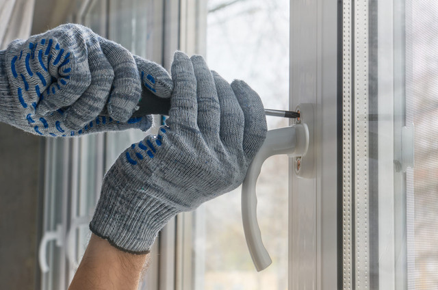 worker mounts handle window frame made plastic.jpg