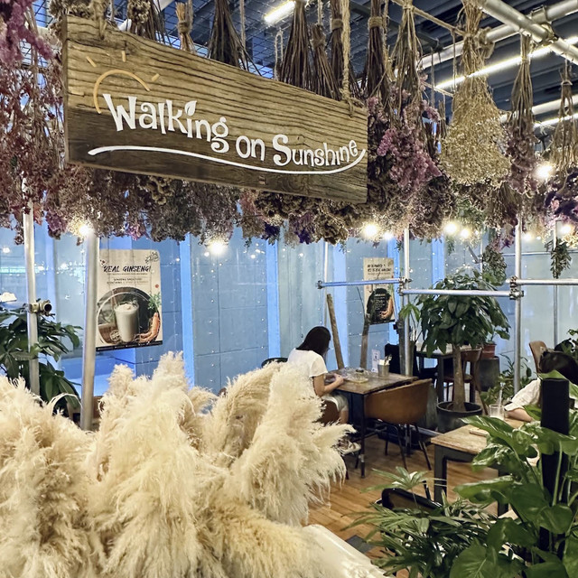 Garden-inspired dining space at Walking On Sunshine in Orchard Central