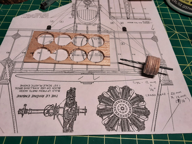Making an engine. It shows a Le Rhone, but almost all DH-2's were powered by the Gnome Monosoupape. Glued to the drill bit to use as a lathe.