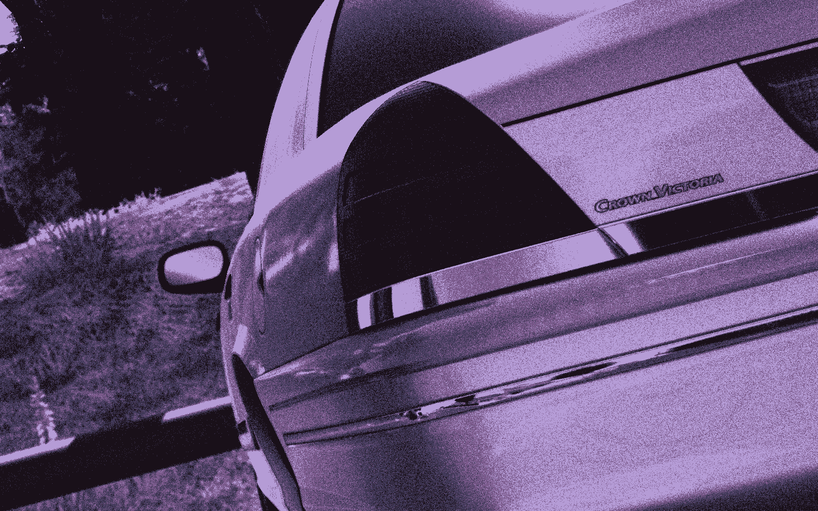 A stylized close-up of the rear end of a Ford Crown Victoria.