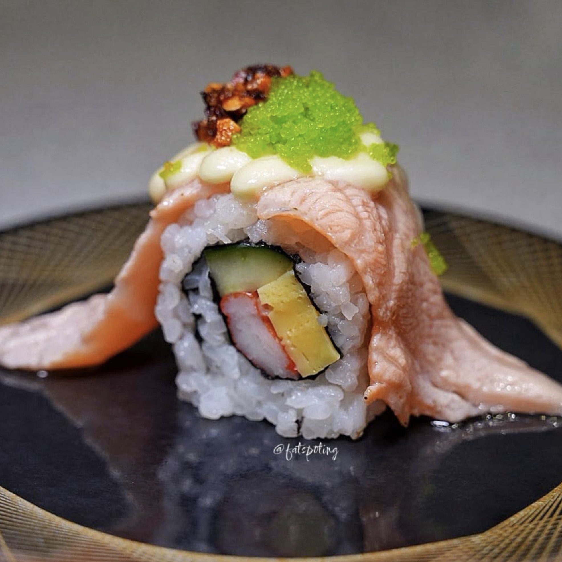 Diners enjoying conveyor belt sushi at Sushi Express PLQ Mall