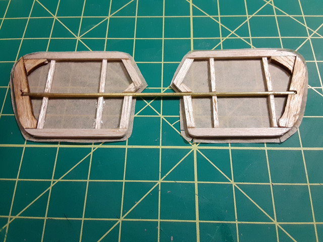 Tail of a Dumas Walnut Scale Fokker E-III. Slit the corners as well as the curves. This prevents folds, which are more visible and unsightly than overlaps.