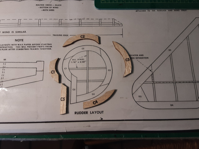 The rudder. Rather than using magnets, I used a little bit of glue to tack the pieces to the plastic tape covering the plans. Another nice benefit of tape.