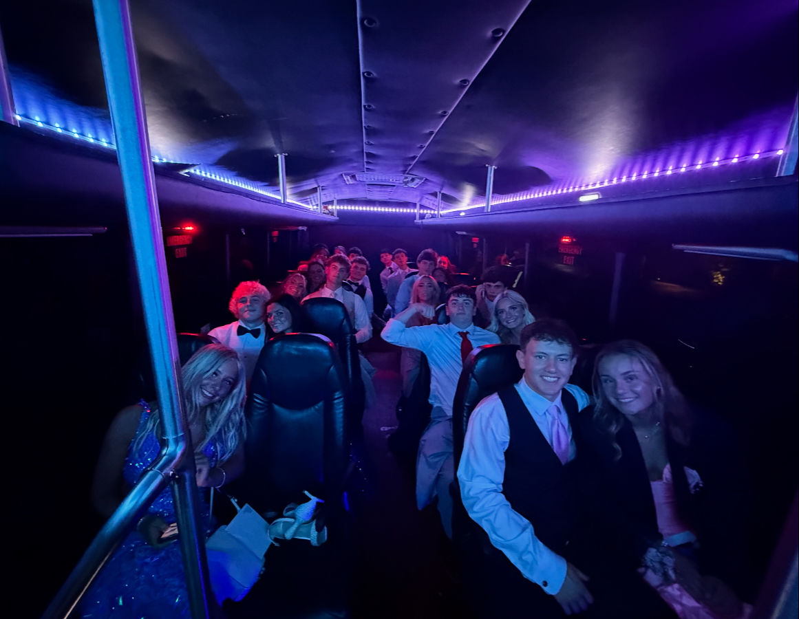 Knight Riders prom bus interior NJ — students celebrating