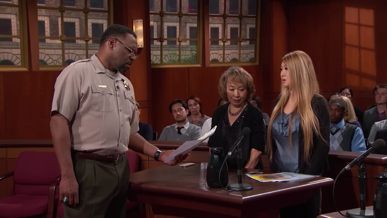 Actual courtroom frame from the uploaded Judge Judy video