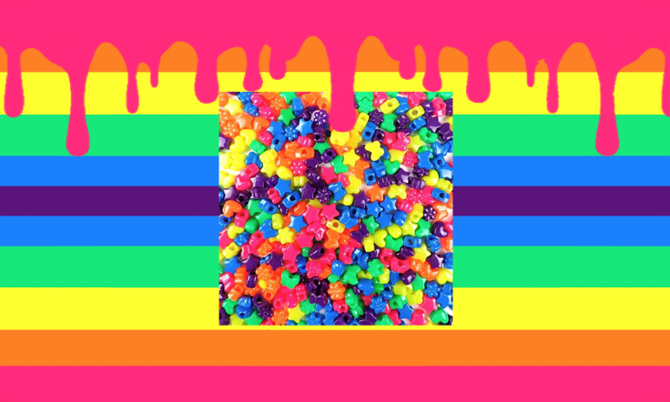 A flag with eleven mirrored stripes. From top to center, they are bright hot pink, bright orange, bright yellow, bright green, bright blue, and dark purple. The top stripe has several drips coming out of it. In the center of the flag, there is a png of plastic beads in different shapes.