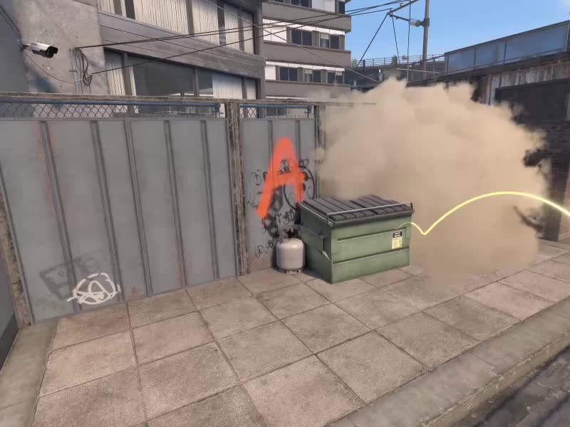 A grenade trajectory enters a CS2 smoke cloud beside a dumpster on Nuke.