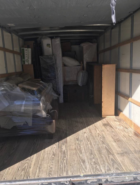 TTM LLC movers delivering furniture in Charlotte, NC