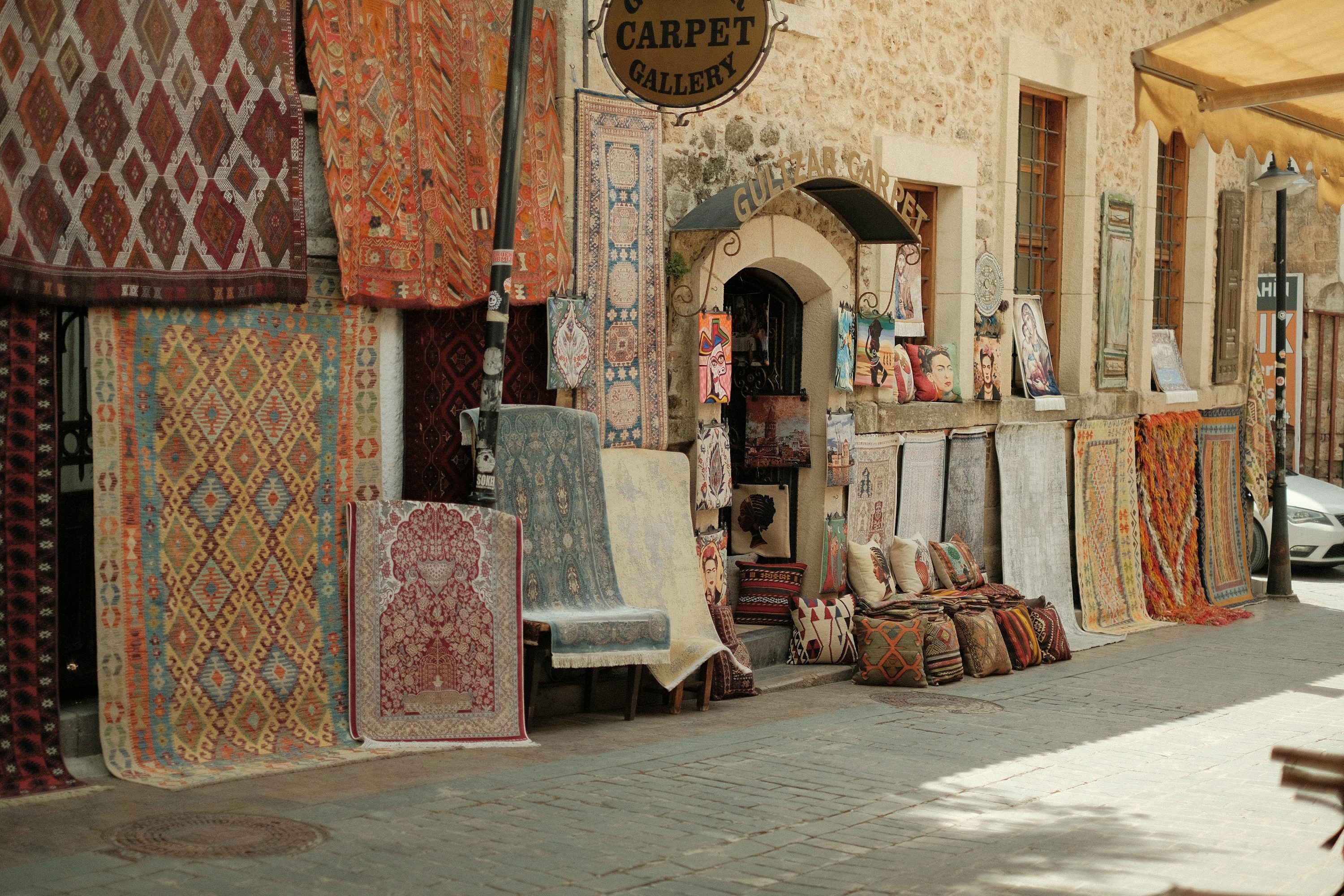 Curated rugs displayed in a refined showroom