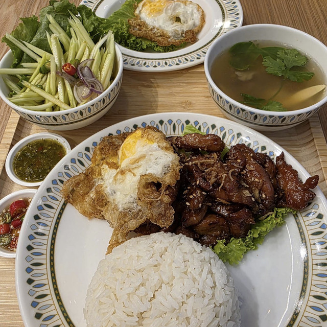 Thai-style stir-fried meat, rice, soup and vegetables served at Sanook Kitchen