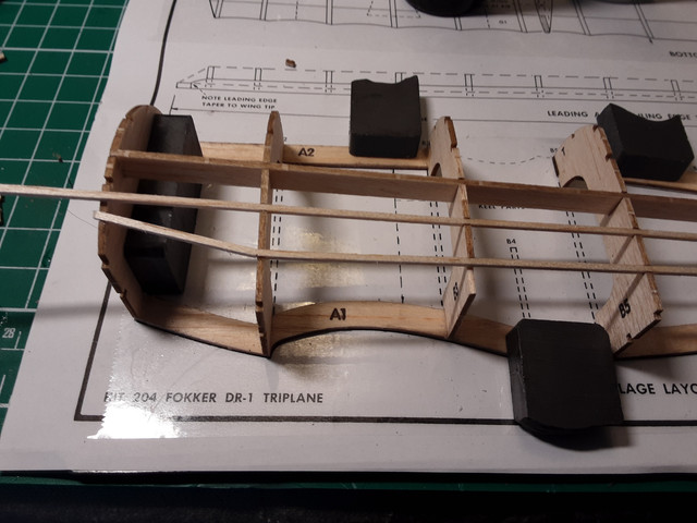 The side keel in place along with a couple of 1/16" stringers. Note that the stringers are cracked just forward of former B2. Check that the formers are perpendicular to the keel before you glue them to the side keel. They flex out of position easily.
