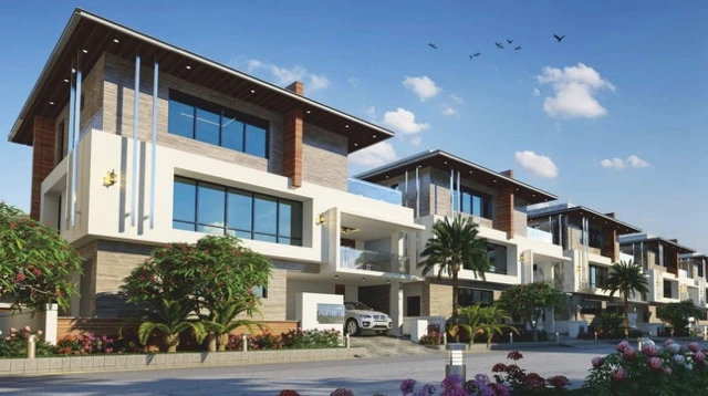 Spacious double-height living room layout featuring premium vitrified flooring inside a Hallmark villa