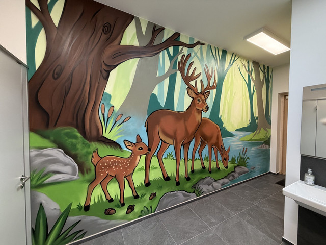 Deer family mural — Schloss Kewenig women's restroom