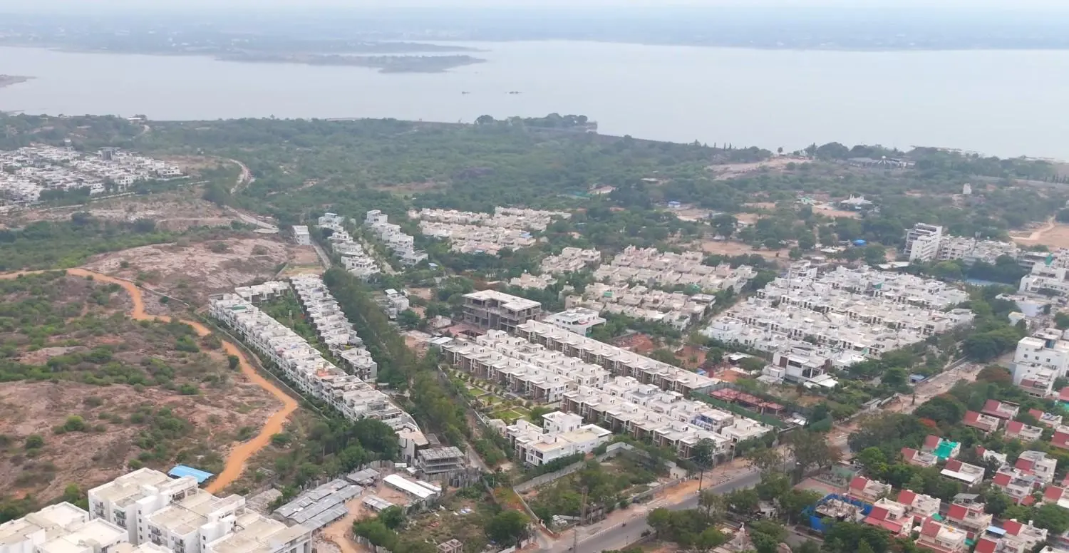 Aerial view of Osman Sagar lake park and luxury estates in Gandipet