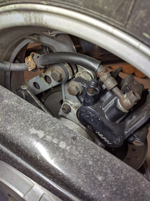 Brake-caliper-and-brackets-before-cleanup.jpg