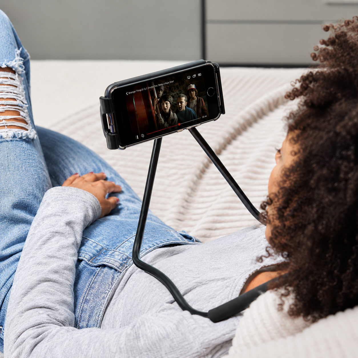 Neck phone holder showing flexible positions