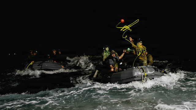Navy divers return to well deck after recovering Orion