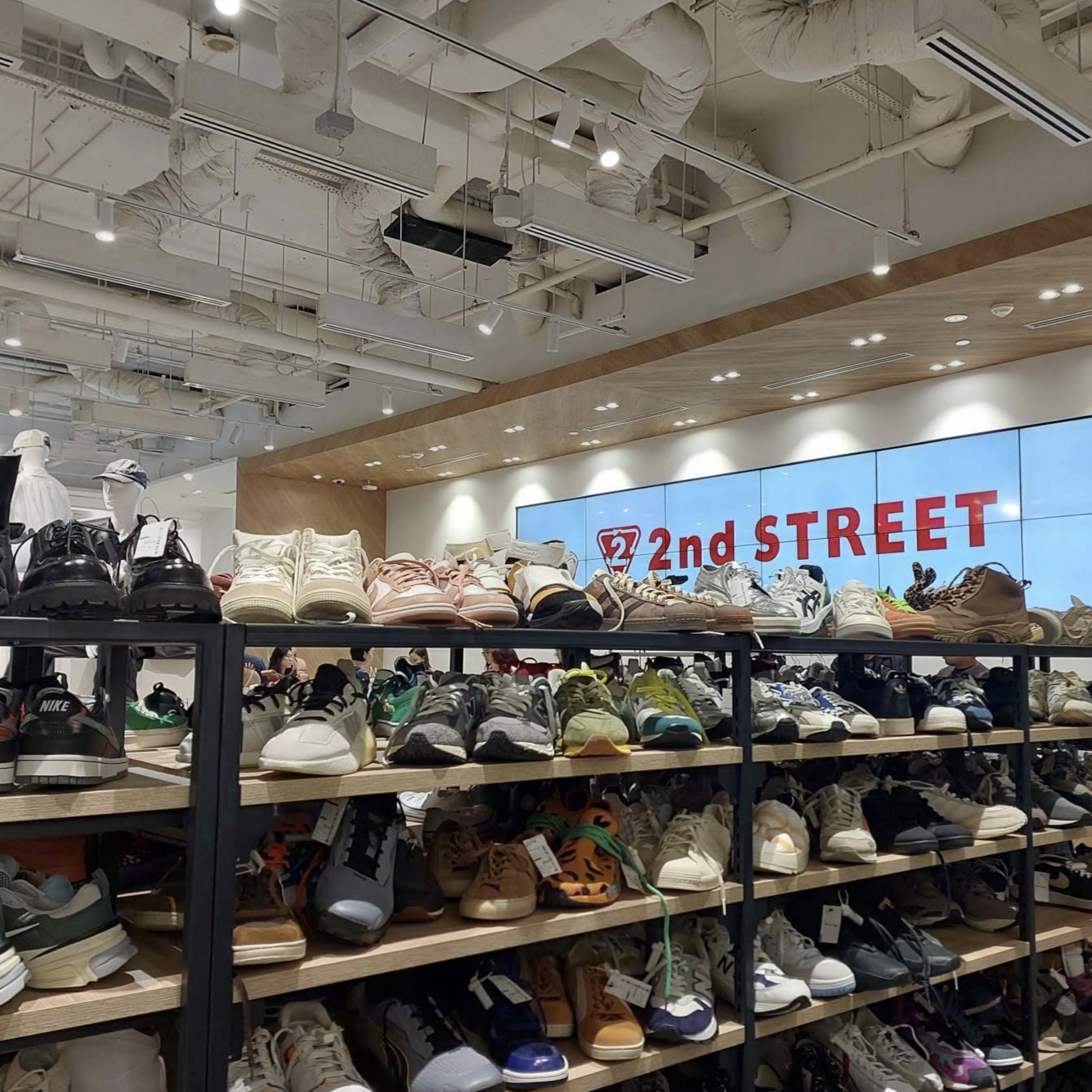 Racks of secondhand clothing at 2nd STREET