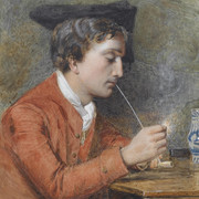 A man lighting a pipe
